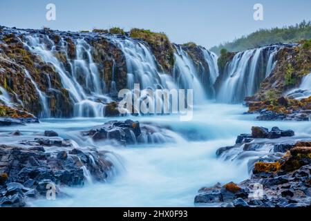 Dramatic views of the bright powerful Bruarfoss waterfall. Popular tourist attraction. Unusual and picturesque scene. Location place South Iceland, Eu Stock Photo