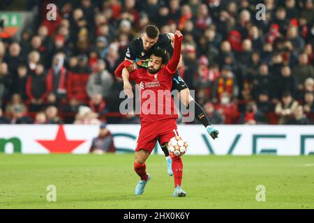 Liverpool, UK. 08th Mar, 2022. Ivan Perisic of Inter Milan jumps above Mohamed Salah of Liverpool. UEFA Champions league, round of 16 match, 2nd leg, Liverpool v Inter Milan at Anfield Stadium in Liverpool on Tuesday 8th March 2022. this image may only be used for Editorial purposes. Editorial use only, license required for commercial use. No use in betting, games or a single club/league/player publications. pic by Chris Stading/Andrew Orchard sports photography/Alamy Live news Credit: Andrew Orchard sports photography/Alamy Live News Stock Photo