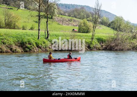 Echternach - Grand Duchy of Luxembourg - 04 13 2019 - Two teenagers kayaking at the Sauer river, the border between the Grand Duchy of Luxembourg and Stock Photo