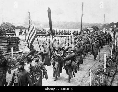 US Army troops marching after disembarking at Le Havre in France Stock Photo