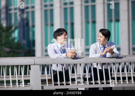 Japanese Businessmen Chatting Stock Photo