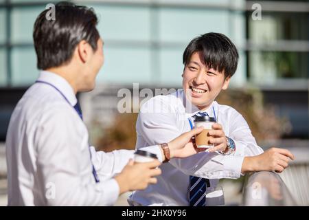 Japanese Businessmen Chatting Stock Photo