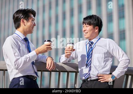 Japanese Businessmen Chatting Stock Photo