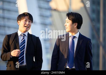 Japanese Businessmen Walking Stock Photo