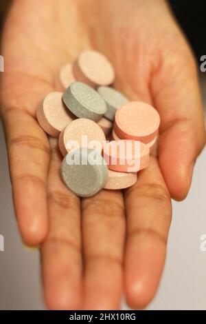 Medicine on Hand Palm, Antacid Medicine , Antacid pills, Medicine pill Stock Photo