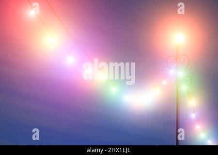 Luminous lamppost with bright and multicolored light bulbs, garlands for festive festival Stock Photo