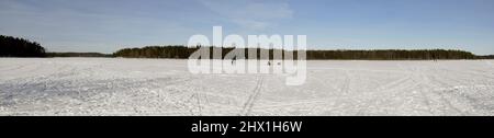 Panorama view of the frozen lake Saimaa on a sunny March day, Lappeenranta Finland Stock Photo