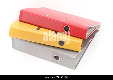 Yellow, gray and red office folder on white background. Stock Photo
