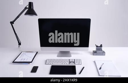An organised space. Studio shot of an organized office workstation. Stock Photo