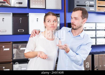 Girl with boyfriend looking for mailbox Stock Photo