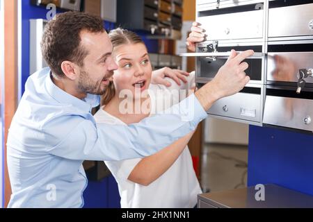 Couple choosing mailbox Stock Photo