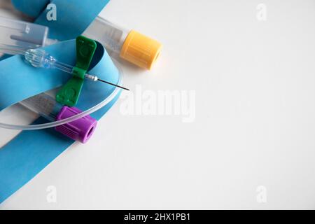 Butterfly needle. Intravenous (IV) needle with a plastic butterfly  housing. A needle housing is termed a cannula. Needles of this design are  used w Stock Photo - Alamy