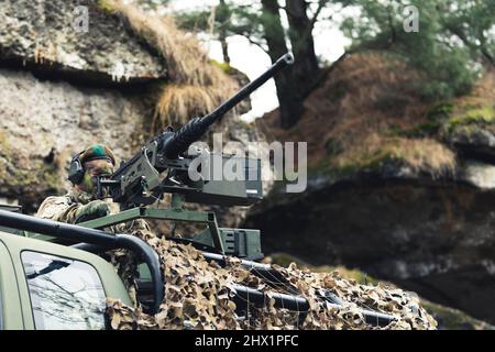 Rugged military grade machine gun mounted on truck unit . High quality photo Stock Photo