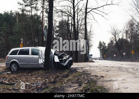 Junked family wagon car discarded at woods Poland . High quality photo Stock Photo