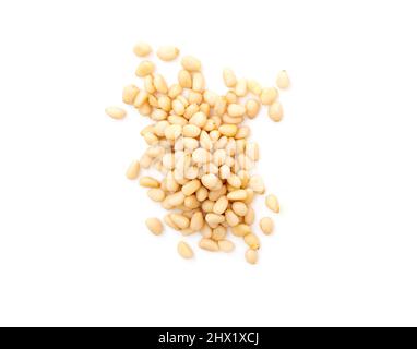 Heap of cedar or pine nuts isolated on white, top view Stock Photo