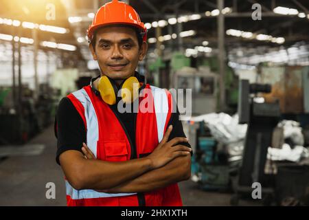 portrait of Asian electrical engineer man in factory Stock Photo