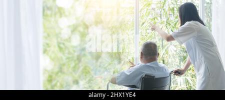 nurse takes care old patient Stock Photo