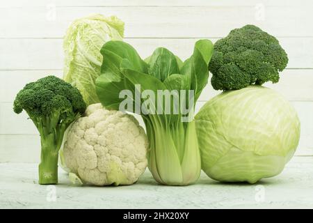 Assortment of different varieties of cabbage cabbage. Background with space for text. Cabbage is different. Various types of green vegetables. white c Stock Photo