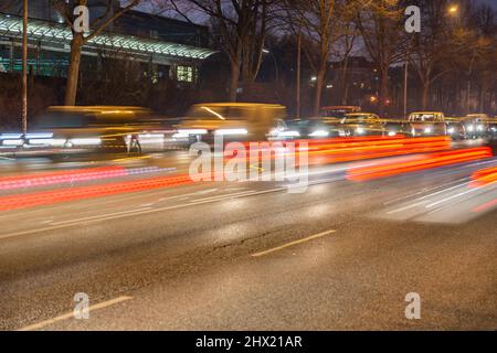 nocturnal light trails on a busy road Stock Photo