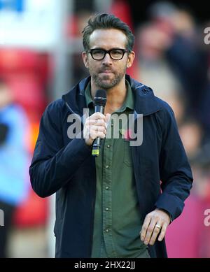 File photo dated 20/10/21 of Wrexham owner Ryan Reynolds at the Racecourse Ground, Wrexham. The Canadian actor has said football is 'a unique brand of gorgeous torture'. The 45-year-old Hollywood star and It's Always Sunny In Philadelphia creator Rob McElhenney took 100% percent ownership of Wrexham AFC in February 2021, taking over from the Wrexham Supporters' Trust, and also making a £2 million investment under the terms of the deal. Issue date: Wednesday March 9, 2022. Stock Photo