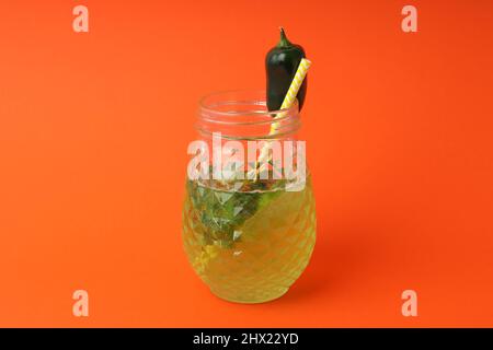 Concept of drink with Jalapeno cocktail on orange background Stock Photo