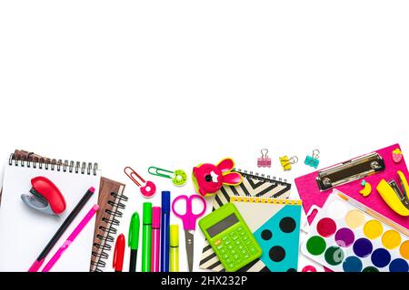 Back to school, education concept. Yellow backpack with school supplies - notebook, pens, ruler, calculator, scissors isolated on white background. Stock Photo