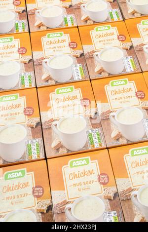 Neatly aligned ASDA own-label instant chicken soup in card boxes. For UK supermarket brand wars, ASDA logo, cup soups, own brand food. Stock Photo