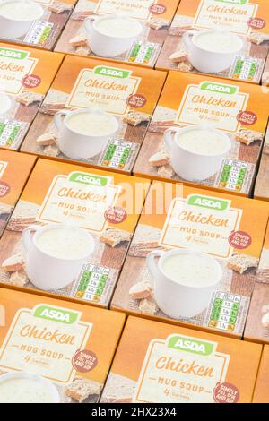 Neatly aligned ASDA own-label instant chicken soup in card boxes. For UK supermarket brand wars, ASDA logo, cup soups, own brand food. Stock Photo