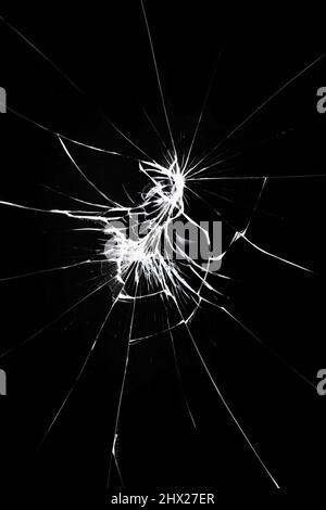 Cracks on the smartphone screen, break the glass on the phone. Effect for design on a black background Stock Photo