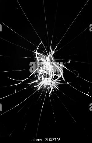 White lines of cracks on the glass. Broken glass texture effect Stock Photo