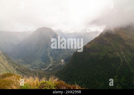 Fiordland New Zealand mountains in haze, Mount Hard and Mount Pillans above Arthur Valley, Milford Track Stock Photo