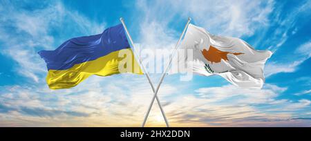 crossed national flags of Ukraine and Cyprus flag waving in wind at ...