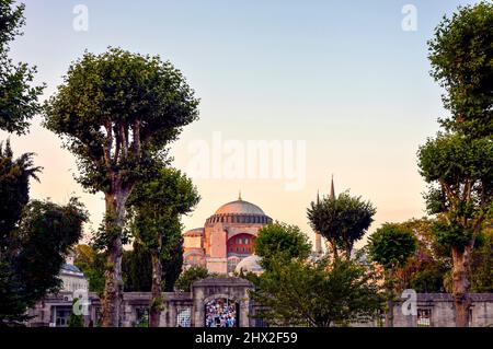 Exterior view of the facade and entrance of the Basilica of Santa Sophia in Istanbul, Turkey in the late afternoon.