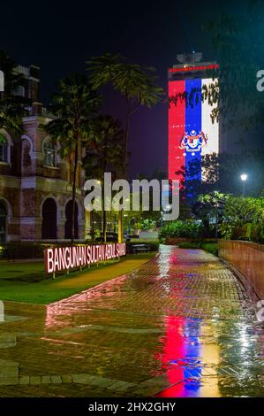 DBKL Building Taken From the Rear of the Sultan Abdul Samad Building at Night and When Raining, showing the Kuala Lumpur Flag Stock Photo