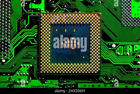 Macro Close up of microchips and pins on Main CPU PC processor circuit board. Stock Photo