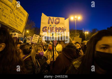 A protester holds a placard that says 'No to war' during the International Women's Day demonstration in Madrid. (Photo by Luis Soto / SOPA Images/Sipa USA) Stock Photo