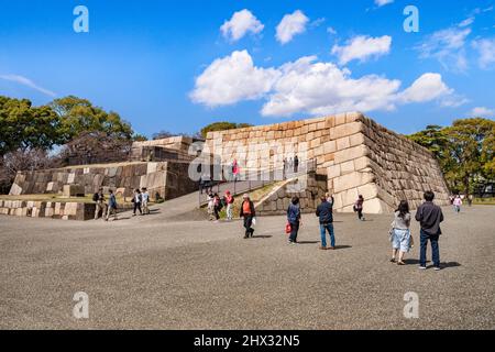 21 March 2019: Tokyo, Japan - Visitors at the former site of the main keep of Edo Castle, now part of the Imperial Palace grounds. Stock Photo