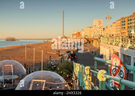 14 January 2022: Brighton, East Sussex, UK - Early morning on Brighton Promenade, With the old West Pier, in winter. Stock Photo