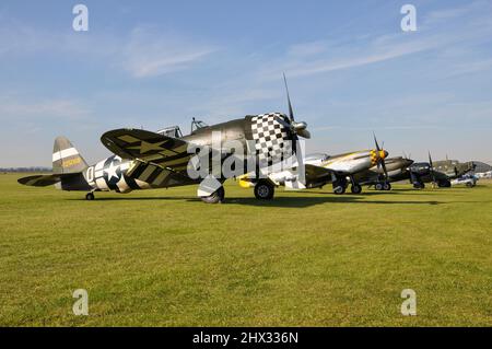 Republic P-47 Thunderbolt, World War Two, Second World War fighter plane on the flight line with P-51 Mustang and other airplanes. WWII planes Stock Photo