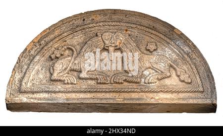 Sculpted tympanum of two lions with one head at the cathedral of Lund, Sweden, November 3, 2021 Stock Photo