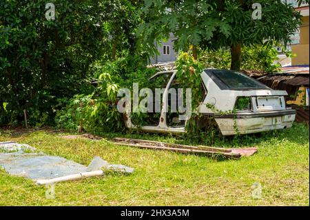 Old Abandoned Proton Car at Kampung Baru, Kuala Lumpur Stock Photo