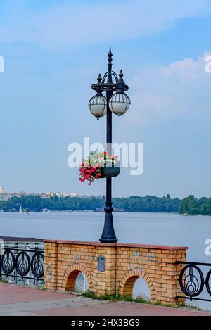 Street lamp with flowers Vases Stock Photo