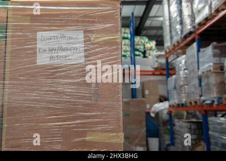 London, UK. 09th Mar, 2022. Inside the Polish food distribution warehouse housing donations for Ukrainian refugees in Croydon in London, UK on 9 March 2022. The donations are loaded on to pallets and delivered by lorry to Poland. (Photo by Claire Doherty/Sipa USA) Credit: Sipa USA/Alamy Live News Stock Photo