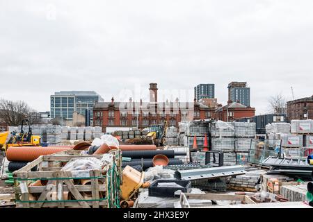 Materials stored in a yard during construction of offices and apartments, Glasgow, Scotland, UK Stock Photo