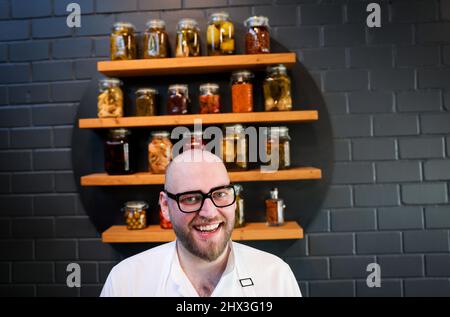 Hamburg, Germany. 09th Mar, 2022. The new two-star chef Thomas Imbusch of the Hamburg restaurant "100/200 Kitchen" stands after the award of the Michelin stars 2022 for German restaurants in his restaurant. The "Guide Michelin" presented the new Germany edition of its restaurant guide on Wednesday in Hamburg. The "100/200 Kitchen" received its second Michelin star. Credit: Christian Charisius/dpa/Alamy Live News Stock Photo