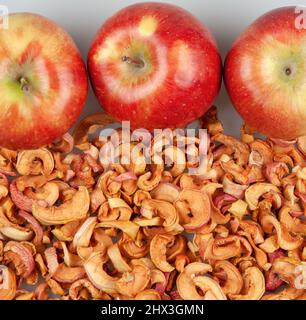Fresh red apples on dried apple slices Stock Photo