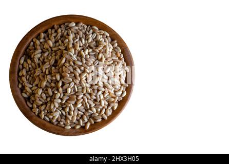 Wooden bowl full of wheat grains,on the white background Stock Photo