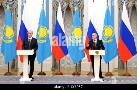 Moscow, Russia. 10 February, 2022. Russian President Vladimir Putin answers a question as Kazakhstan President Kassym-Jomart Tokayev, left, looks on during a joint press conference following bilateral talks at the Kremlin, February 10, 2022 in Moscow, Russia. Stock Photo