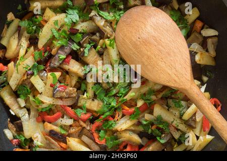 Top view on frying pan full favourite ukrainian  vegetables - red tomotoes,  mangold , parsley, cauliflower, egg-plant,  potato, onions, Stock Photo