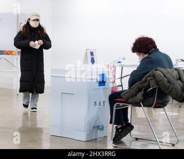 Seoul, South Korea. 09th Mar, 2022. People cast ballots for the presidential election at polling station in Seoul, South Korea on March 9, 2022. (Photo by Lee Young-ho/Sipa USA) Credit: Sipa USA/Alamy Live News Stock Photo